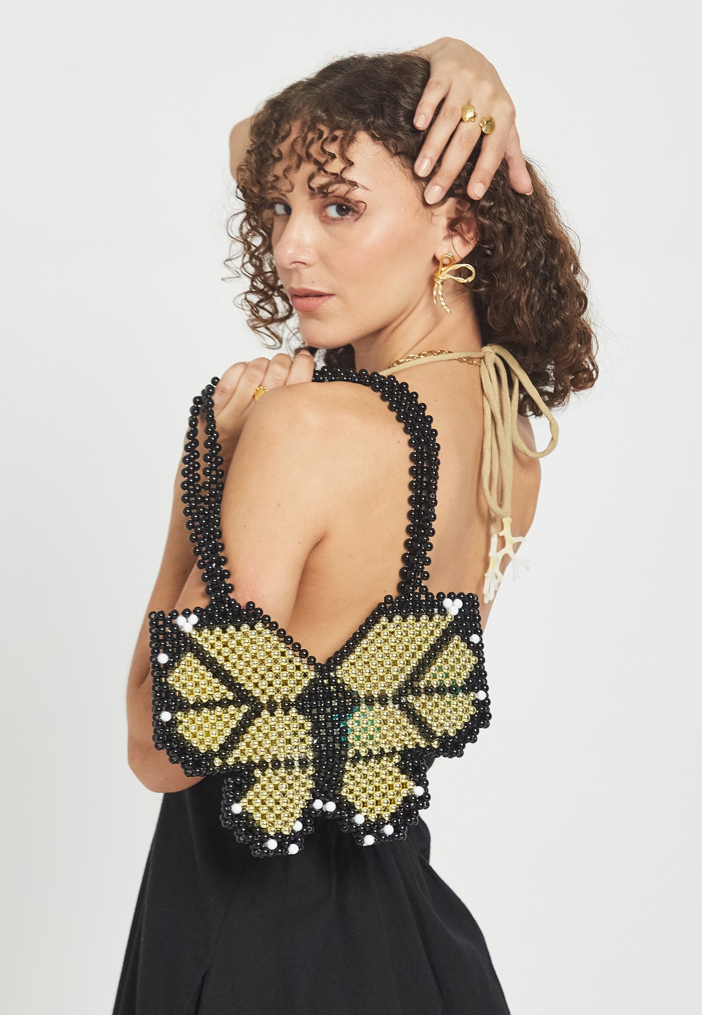 Borsa a mano nera a forma di farfalla